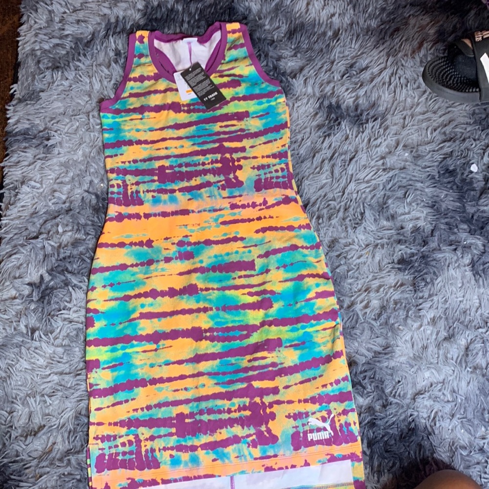 This is a puma dress never worn with price tags. Size small in women’s